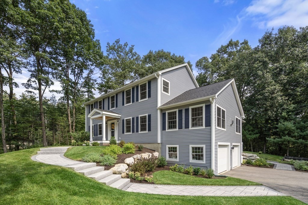 11 Fort Pond Road Acton, MA 01720 - Photo 2 of 40 a front view of a house with a yard