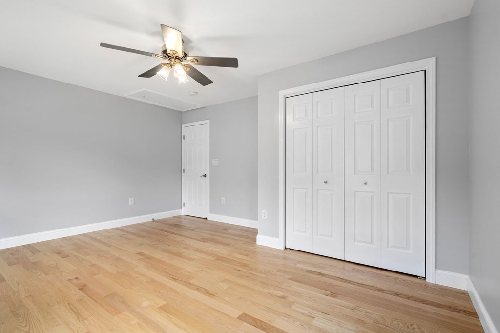 11 Fort Pond Road Acton, MA 01720 - Photo 25 of 40 a view of an empty room with wooden floor