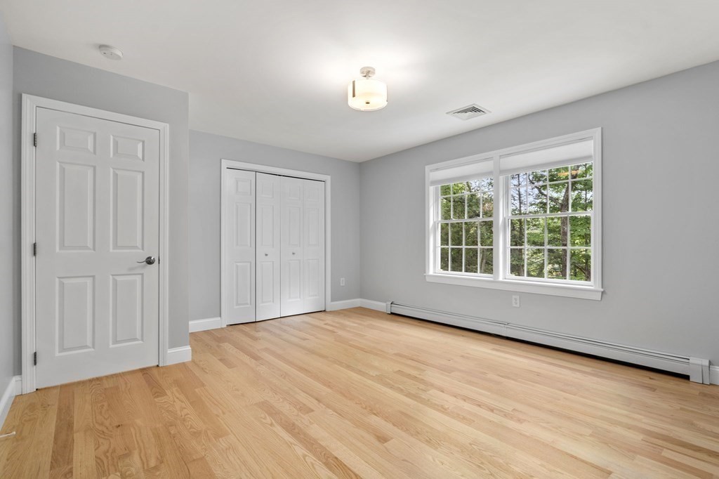 11 Fort Pond Road Acton, MA 01720 - Photo 27 of 40 a view of an empty room with a window