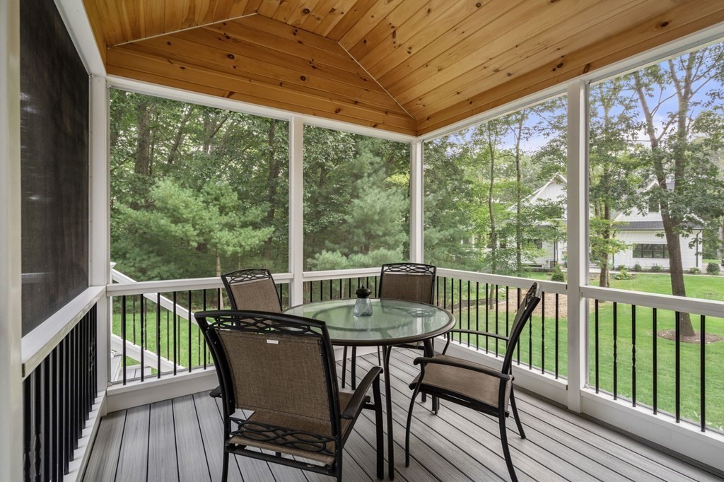 11 Fort Pond Road Acton, MA 01720 - Photo 32 of 40 a view of a chair and table in the balcony