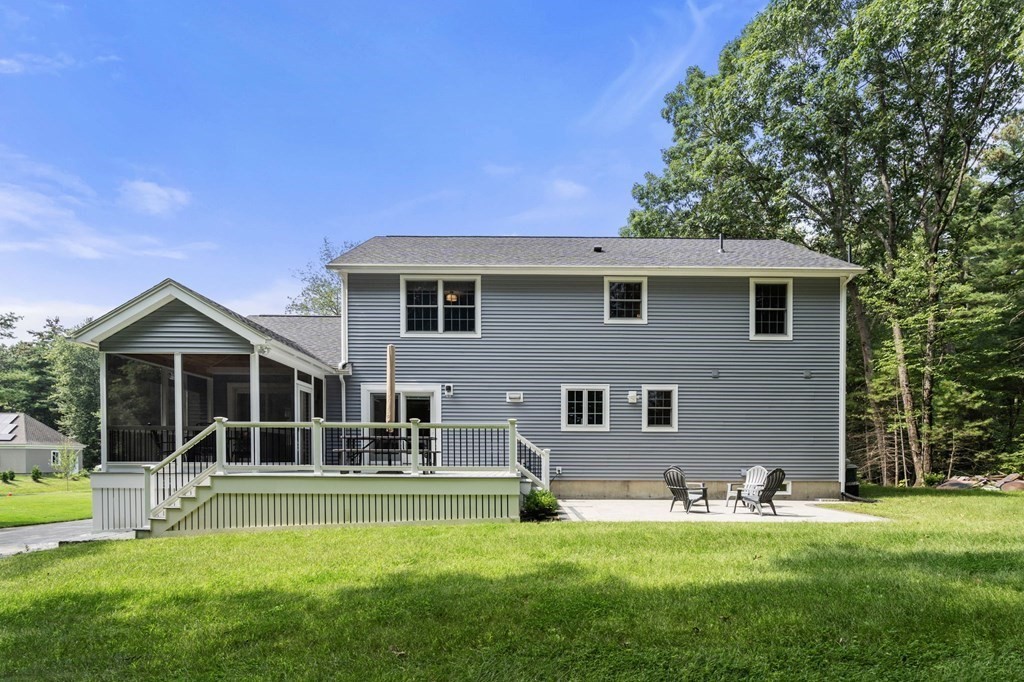 11 Fort Pond Road Acton, MA 01720 - Photo 34 of 40 a front view of a house with a yard