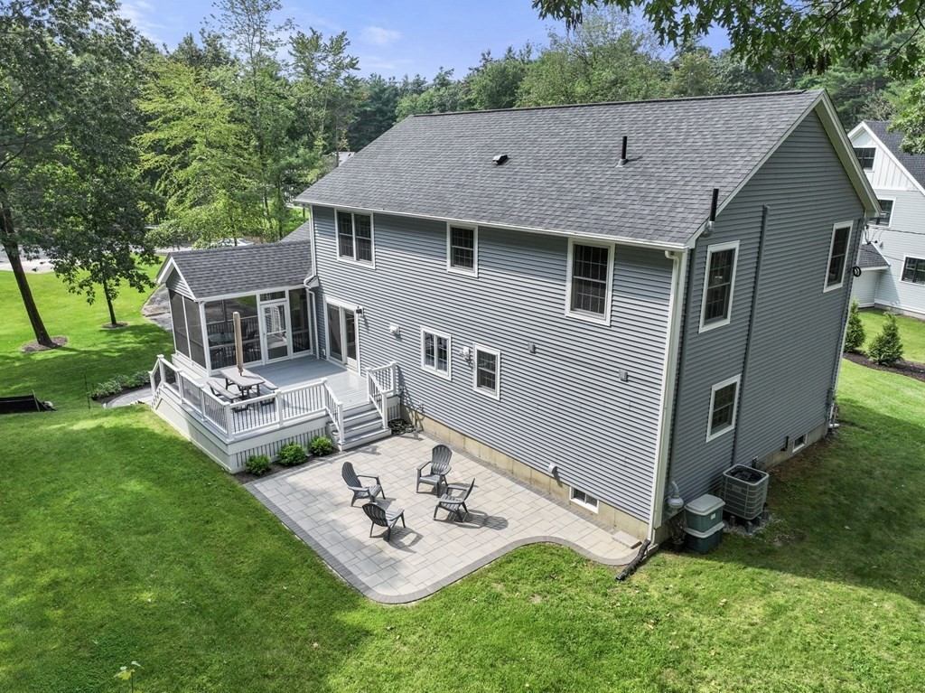 11 Fort Pond Road Acton, MA 01720 - Photo 38 of 40 a view of a house with a backyard and patio