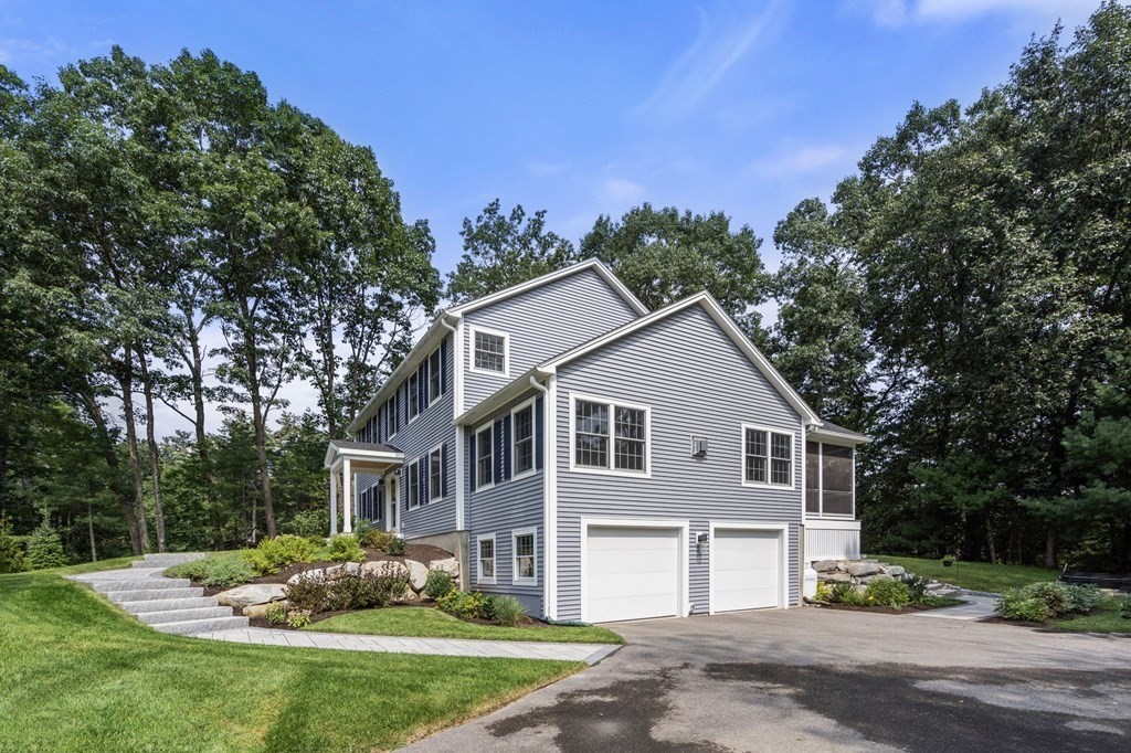 11 Fort Pond Road Acton, MA 01720 - Photo 39 of 40 a front view of a house with a yard