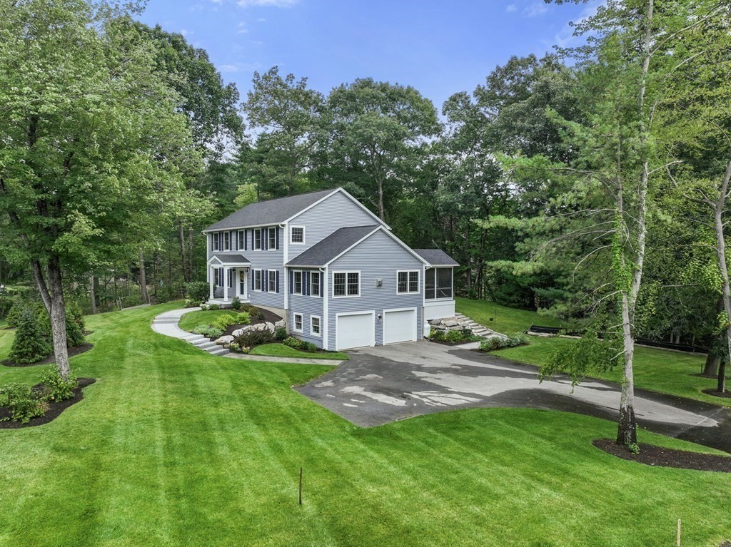11 Fort Pond Road Acton, MA 01720 - Photo 4 of 40 a house view with a garden space