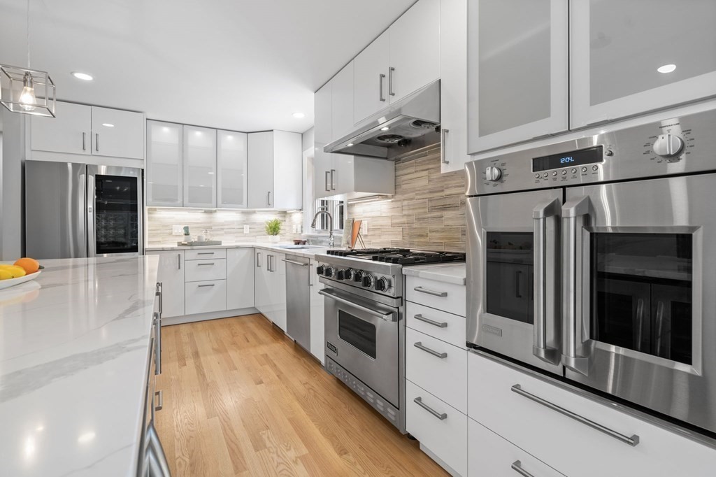 11 Fort Pond Road Acton, MA 01720 - Photo 9 of 40 a kitchen with stainless steel appliances a stove sink and refrigerator