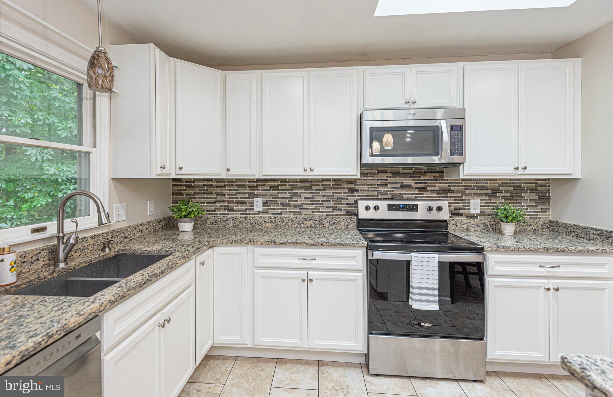 74 Birdnest Drive Ocean Pines, MD 21811 - Photo 11 of 89 a kitchen with cabinets appliances a sink and a counter top space