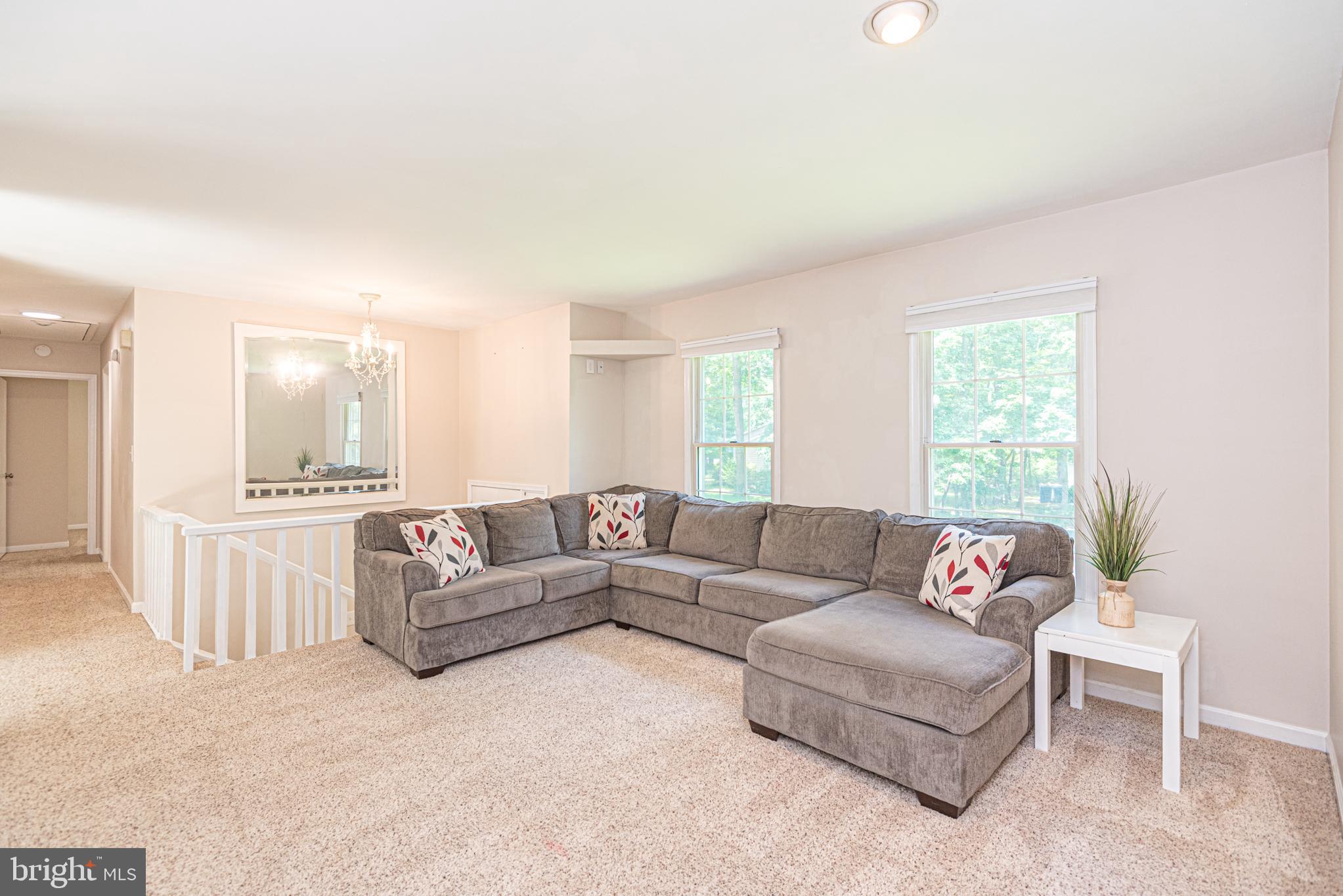 74 Birdnest Drive Ocean Pines, MD 21811 - Photo 17 of 89 a living room with furniture and a large window
