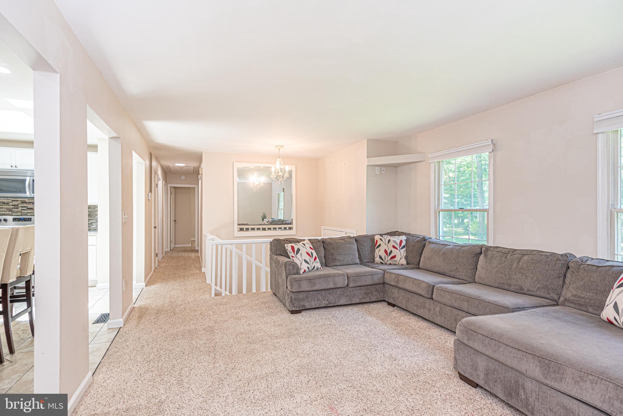 74 Birdnest Drive Ocean Pines, MD 21811 - Photo 18 of 89 a living room with furniture and a large window