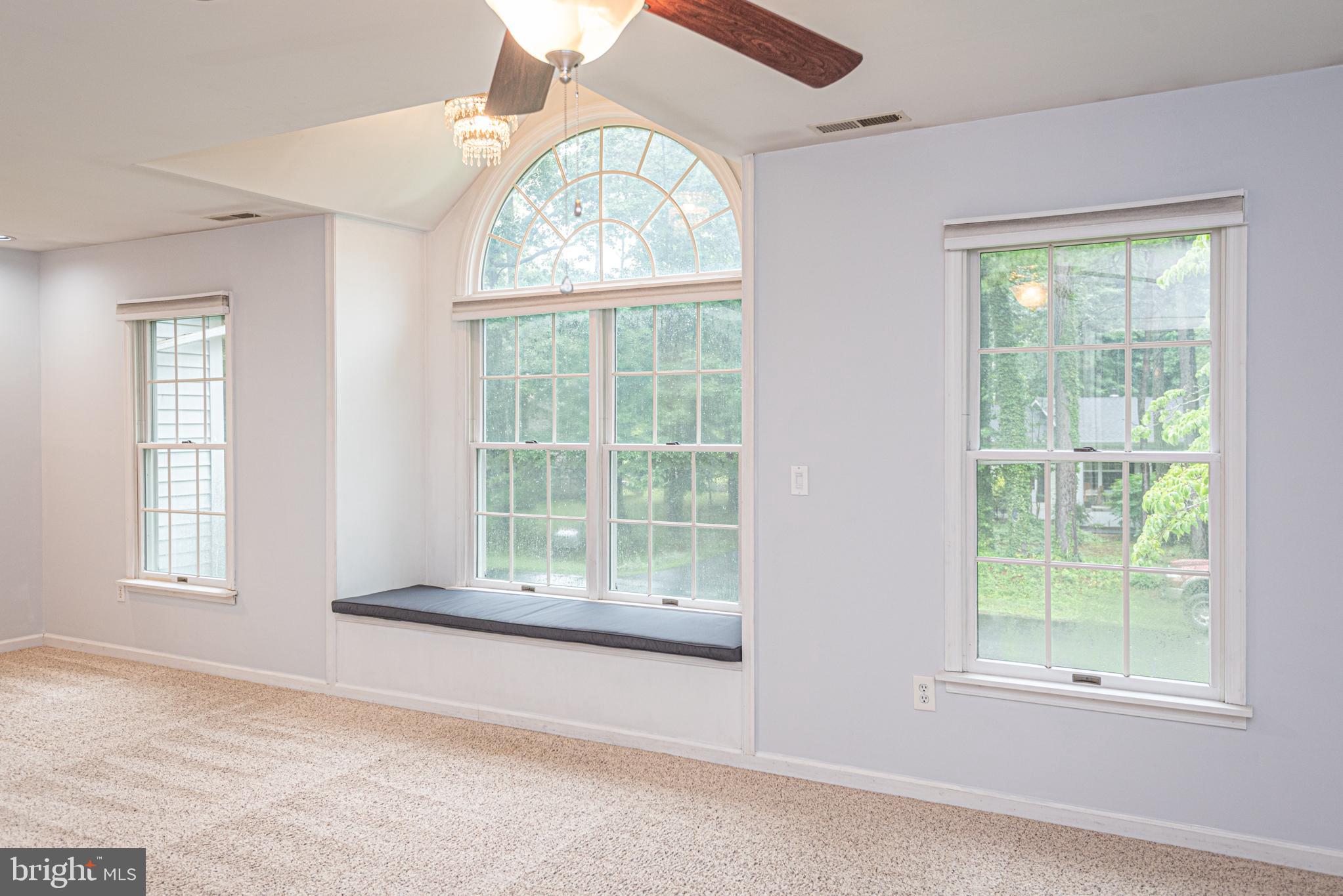 74 Birdnest Drive Ocean Pines, MD 21811 - Photo 30 of 89 an empty room with wooden floor and windows