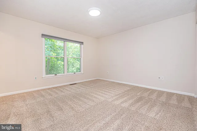 a bathroom with a toilet a sink and a mirror