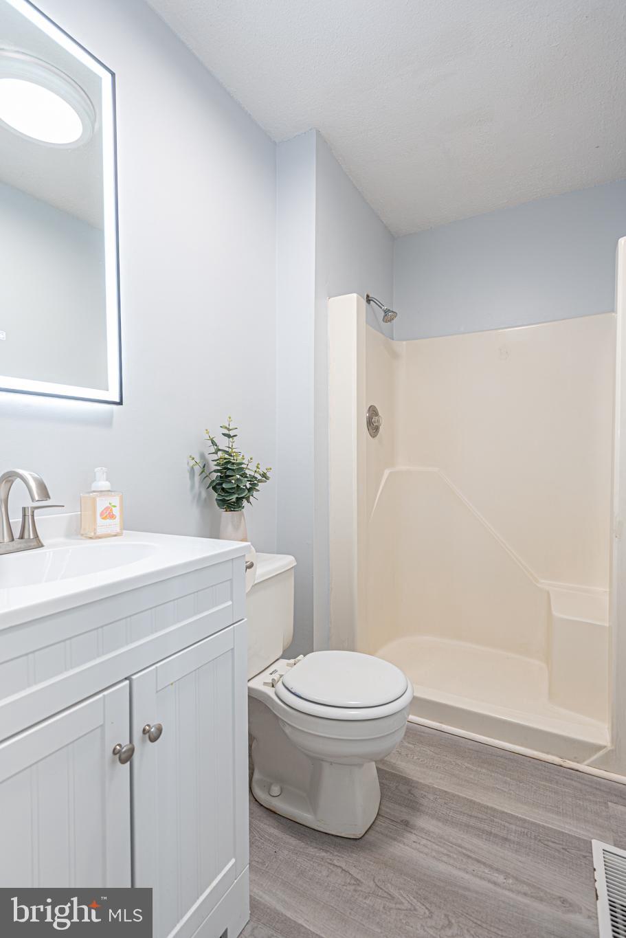 74 Birdnest Drive Ocean Pines, MD 21811 - Photo 40 of 89 a bathroom with a sink a toilet and shower