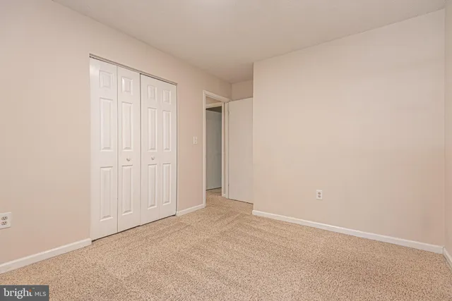 an aerial view of a pool patio chairs and fire pit
