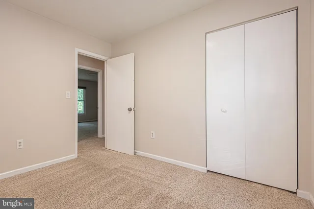 an aerial view of a swimming pool with outdoor seating