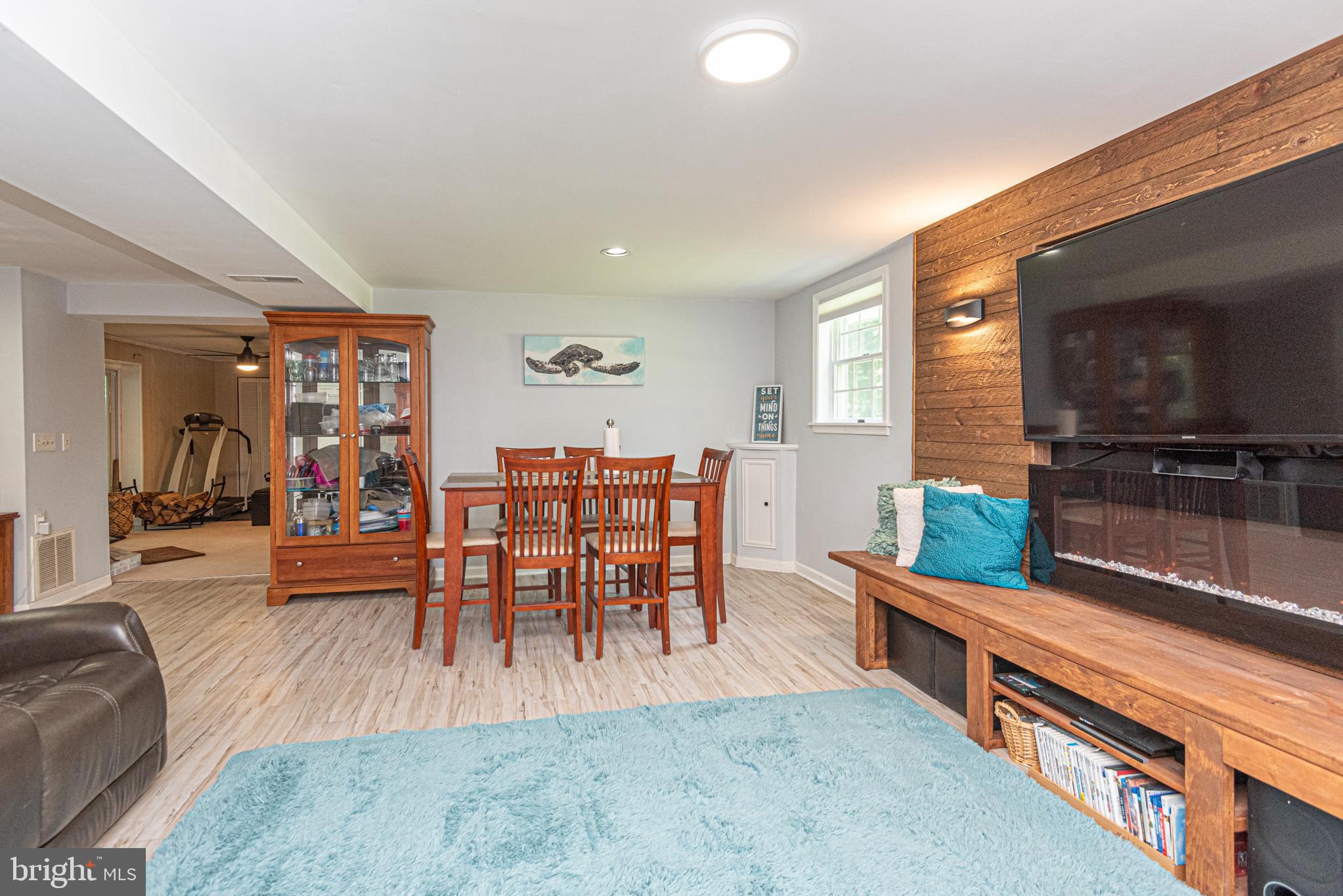 74 Birdnest Drive Ocean Pines, MD 21811 - Photo 56 of 89 a living room with furniture a flat screen tv and kitchen view