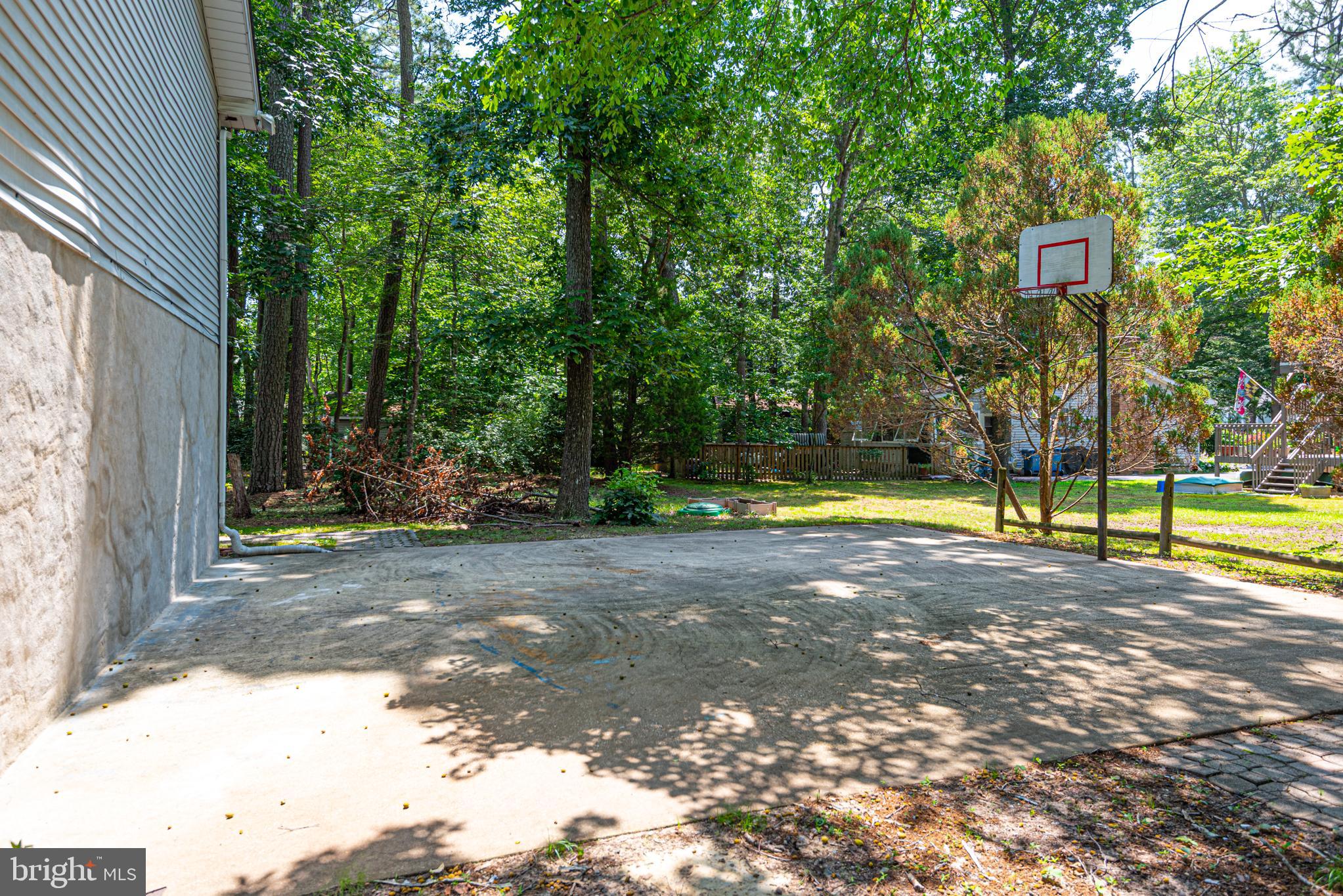 74 Birdnest Drive Ocean Pines, MD 21811 - Photo 72 of 89 a view of a backyard with swimming pool
