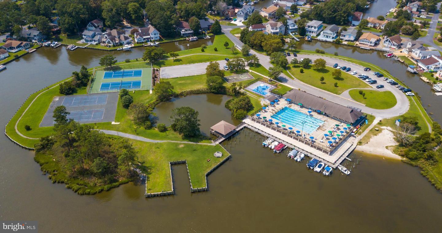 74 Birdnest Drive Ocean Pines, MD 21811 - Photo 86 of 89 an aerial view of a pool patio chairs and fire pit