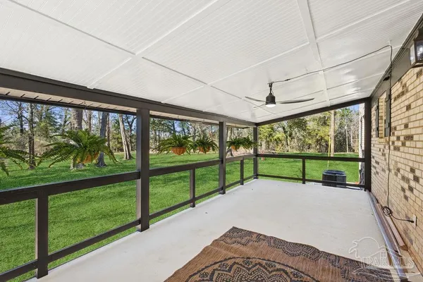 a view of outdoor space with deck and trees