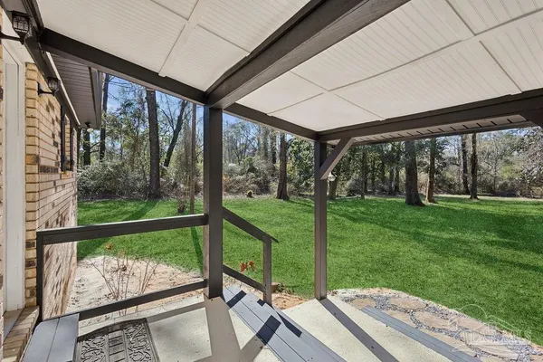 a backyard of a house with lots of green space