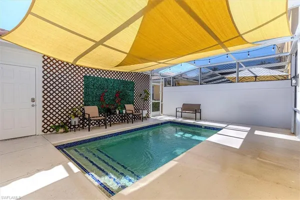 a view of a backyard with sitting area and furniture