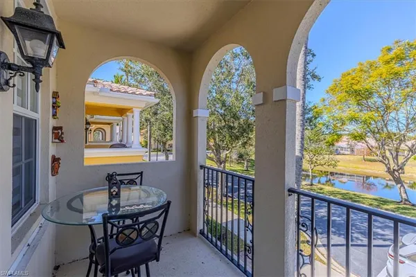 a view of a balcony with chairs