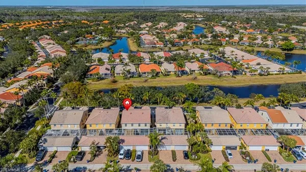 an aerial view of residential houses with outdoor space