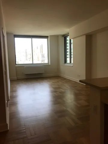 a view of an empty room with a window