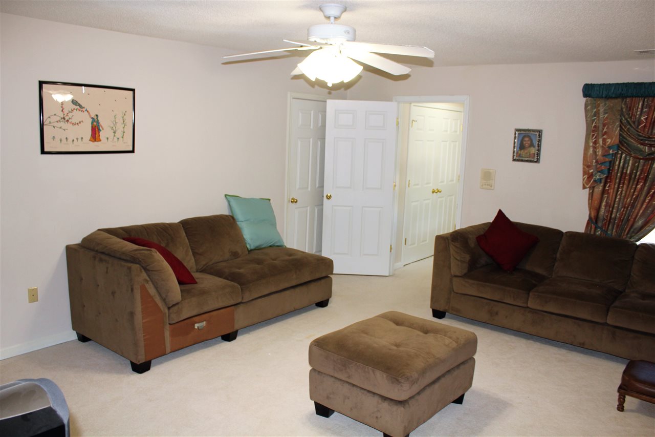 355 Forest Hill-Irene Road Memphis, TN 38018 - Photo 15 of 25 a living room with furniture and a ceiling fan