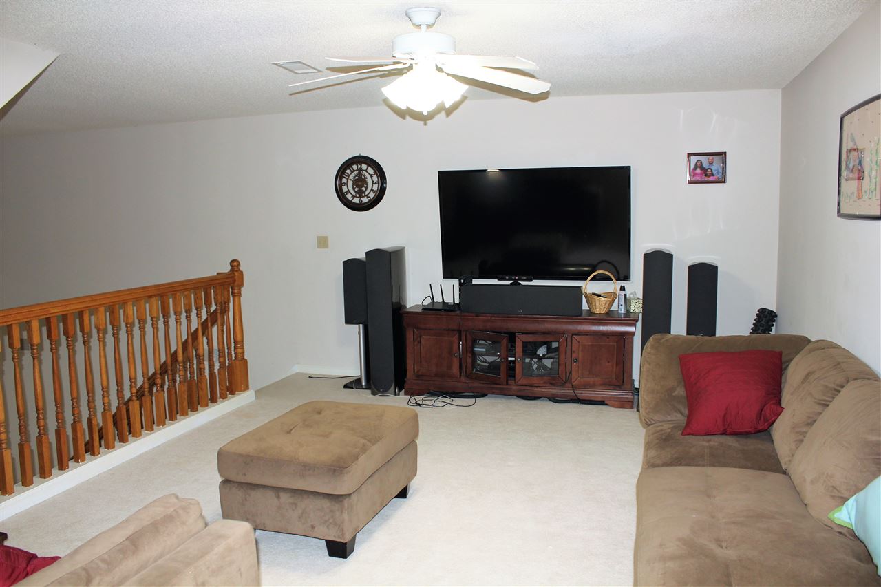 355 Forest Hill-Irene Road Memphis, TN 38018 - Photo 16 of 25 a living room with furniture and a flat screen tv