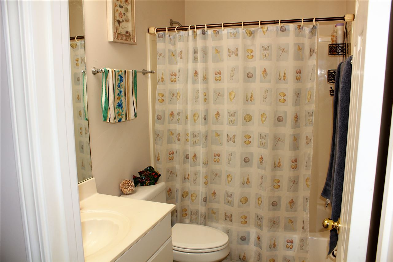 355 Forest Hill-Irene Road Memphis, TN 38018 - Photo 17 of 25 a bathroom with a toilet and a shower curtain