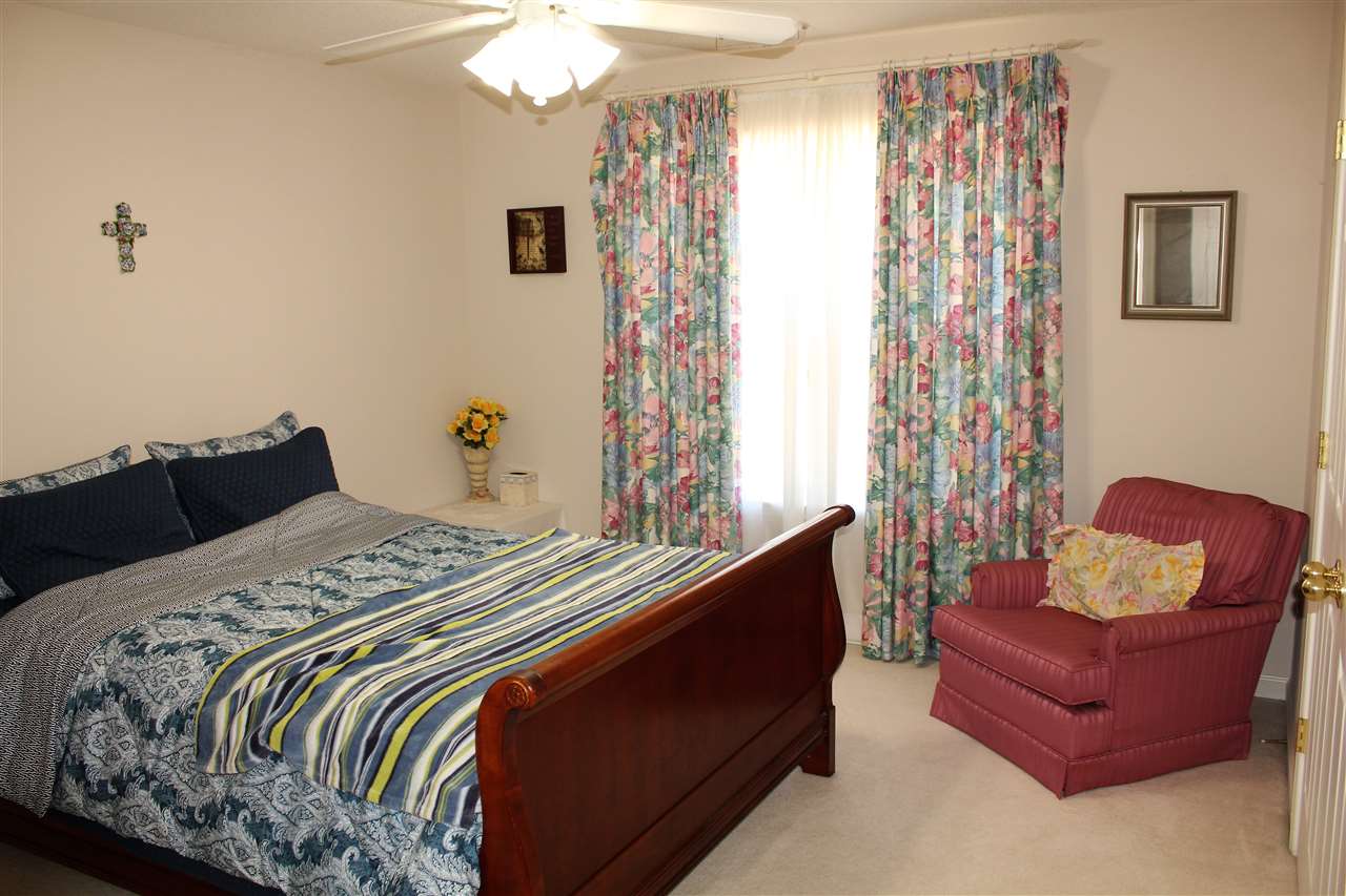 355 Forest Hill-Irene Road Memphis, TN 38018 - Photo 18 of 25 a bedroom with bed and a window