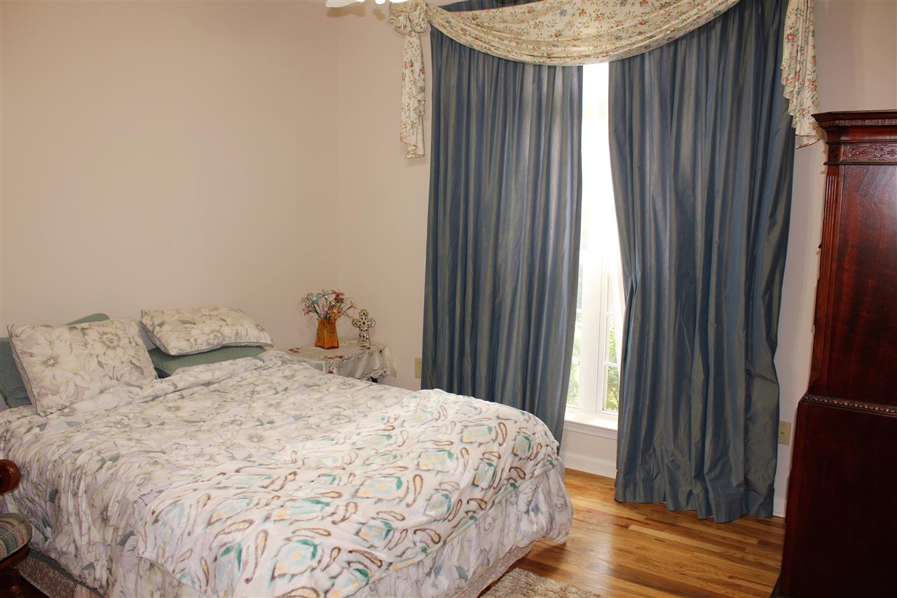355 Forest Hill-Irene Road Memphis, TN 38018 - Photo 20 of 25 a bedroom with a bed and a mirror