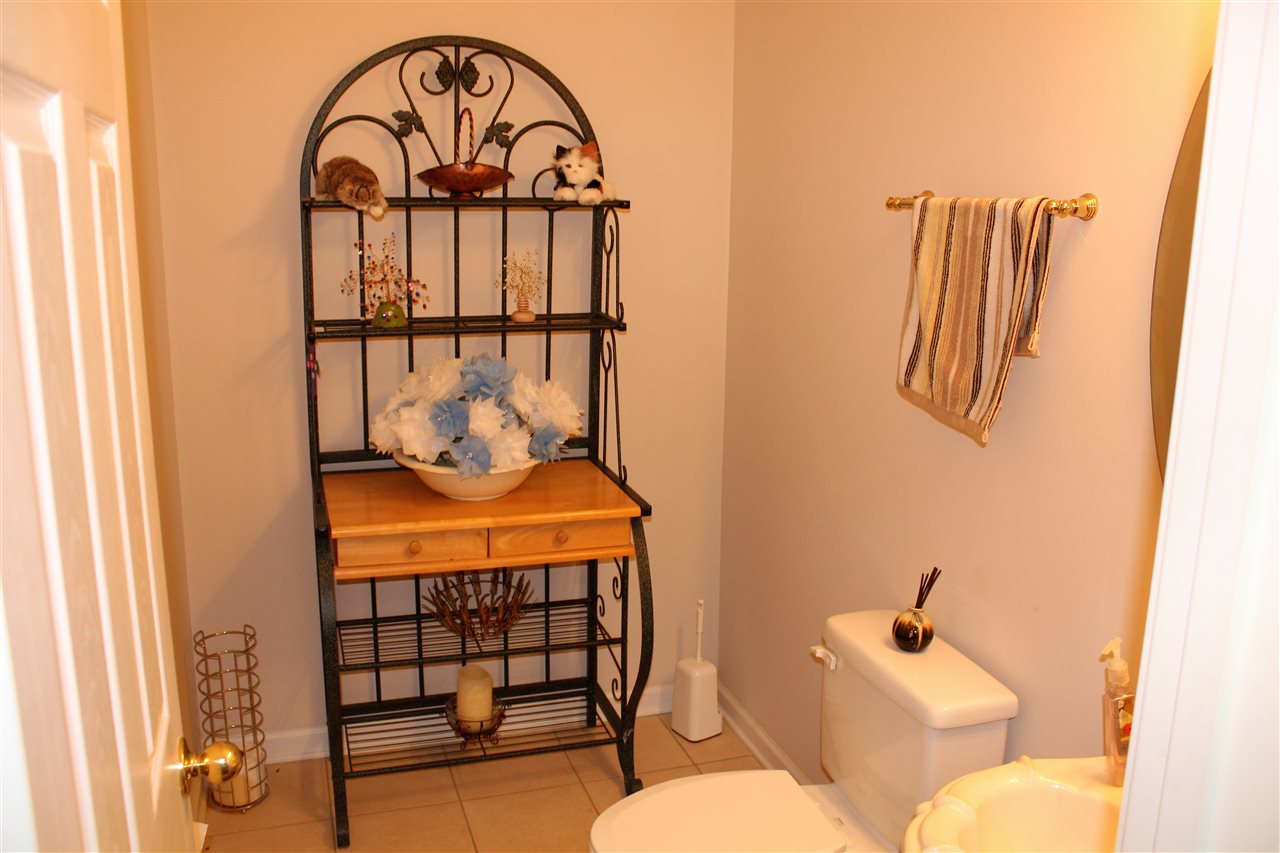 355 Forest Hill-Irene Road Memphis, TN 38018 - Photo 21 of 25 a bathroom with a sink toilet and mirror
