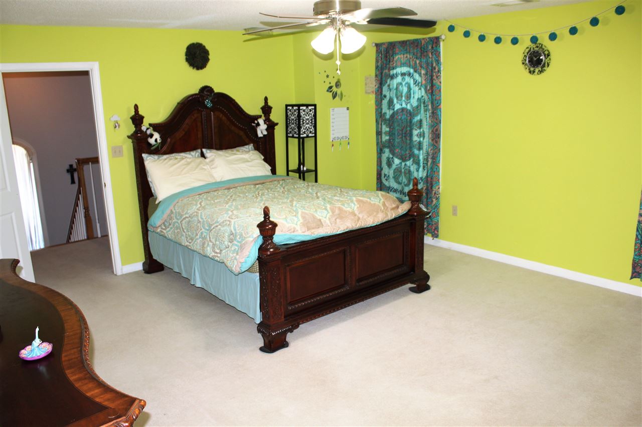 355 Forest Hill-Irene Road Memphis, TN 38018 - Photo 23 of 25 a bedroom with a bed dresser and a window