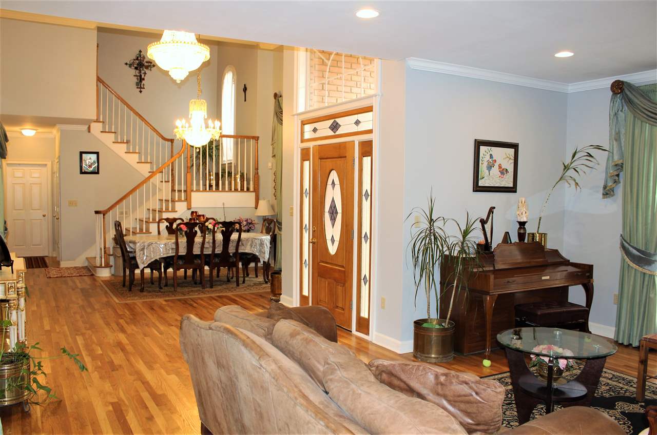 355 Forest Hill-Irene Road Memphis, TN 38018 - Photo 4 of 25 a bedroom with furniture and a wooden floor