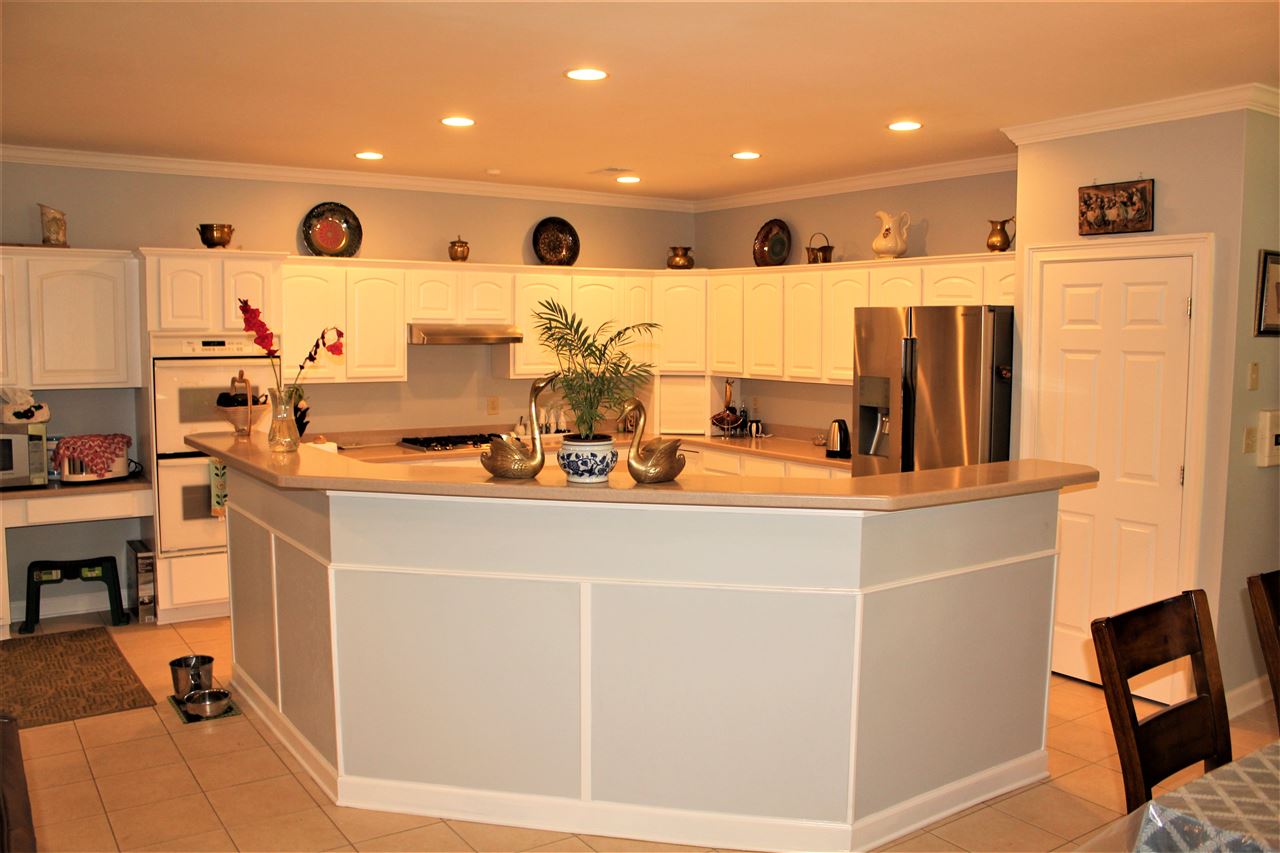 355 Forest Hill-Irene Road Memphis, TN 38018 - Photo 7 of 25 a view of kitchen with stainless steel appliances kitchen island sink refrigerator and microwave