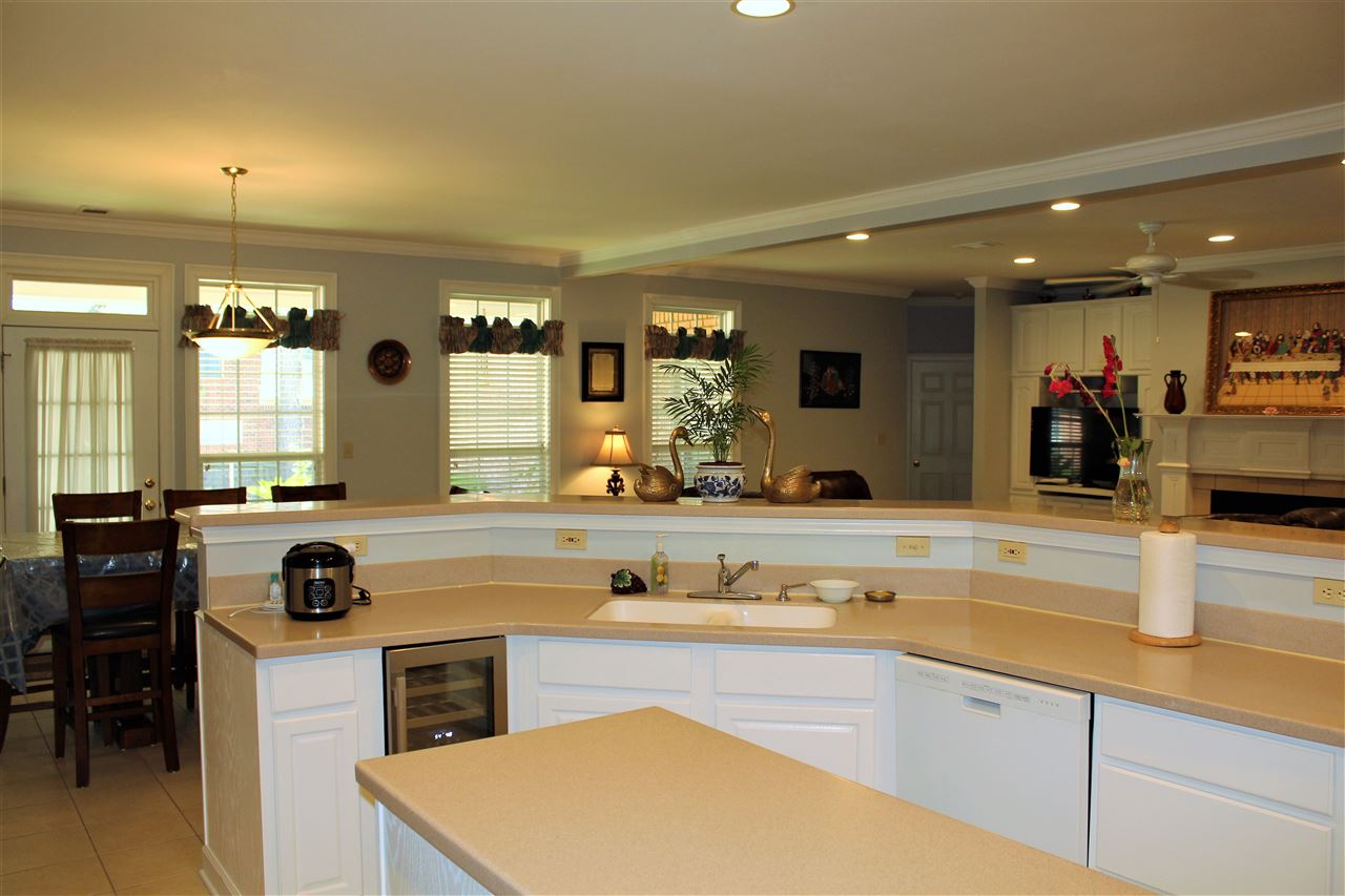 355 Forest Hill-Irene Road Memphis, TN 38018 - Photo 8 of 25 a kitchen with kitchen island granite countertop a sink and white cabinets
