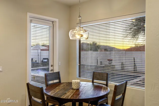 a view of a dining room with furniture and window