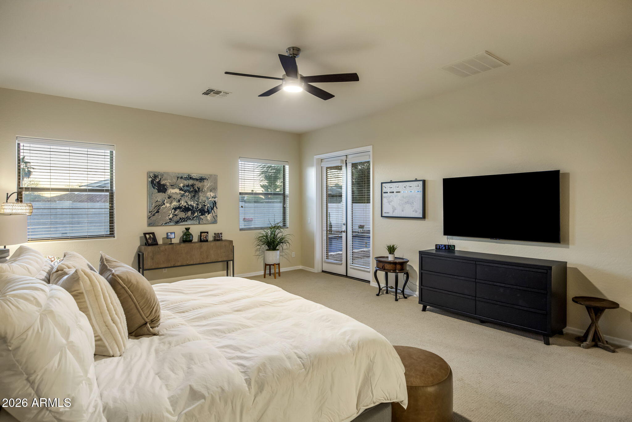 14112 North 12th Street Phoenix, AZ 85022 - Photo 17 of 46 a bedroom with a bed and a flat screen tv