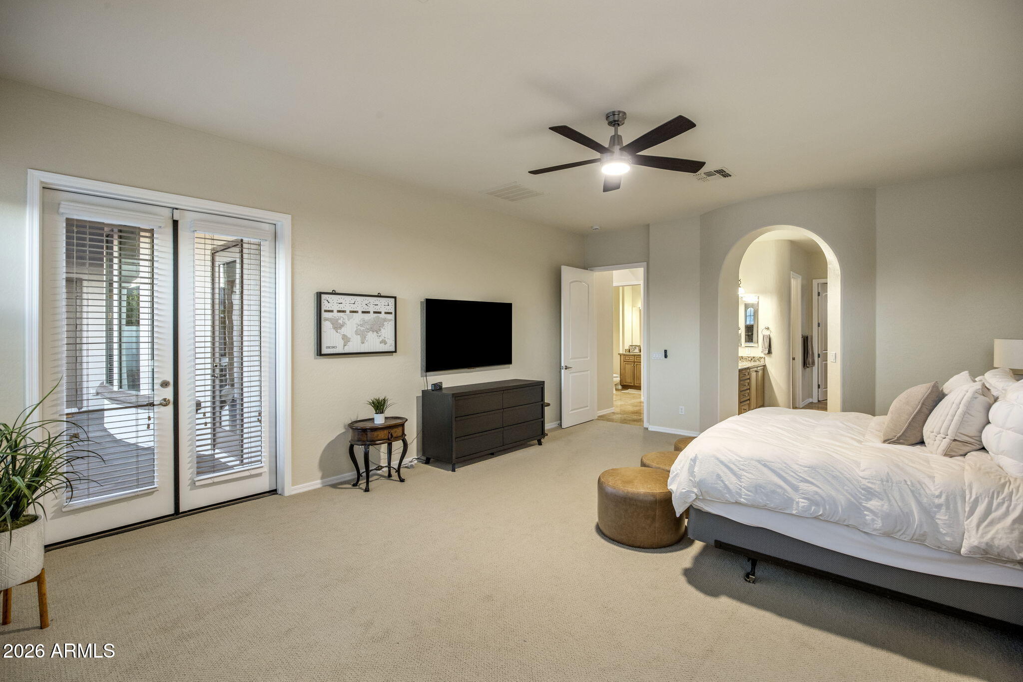 14112 North 12th Street Phoenix, AZ 85022 - Photo 18 of 46 a bedroom with a bed and a flat screen tv