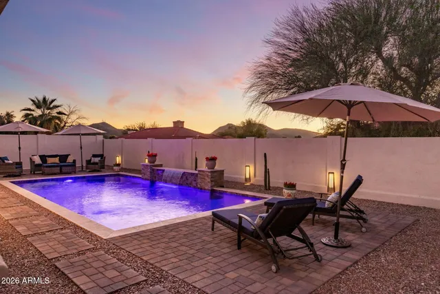 a view of swimming pool with outdoor seating