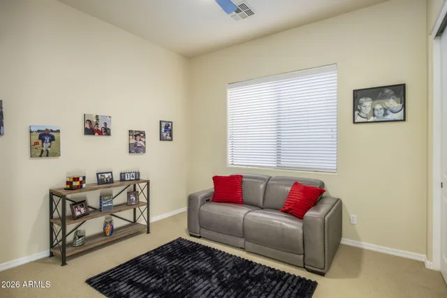 a living room with furniture and a window