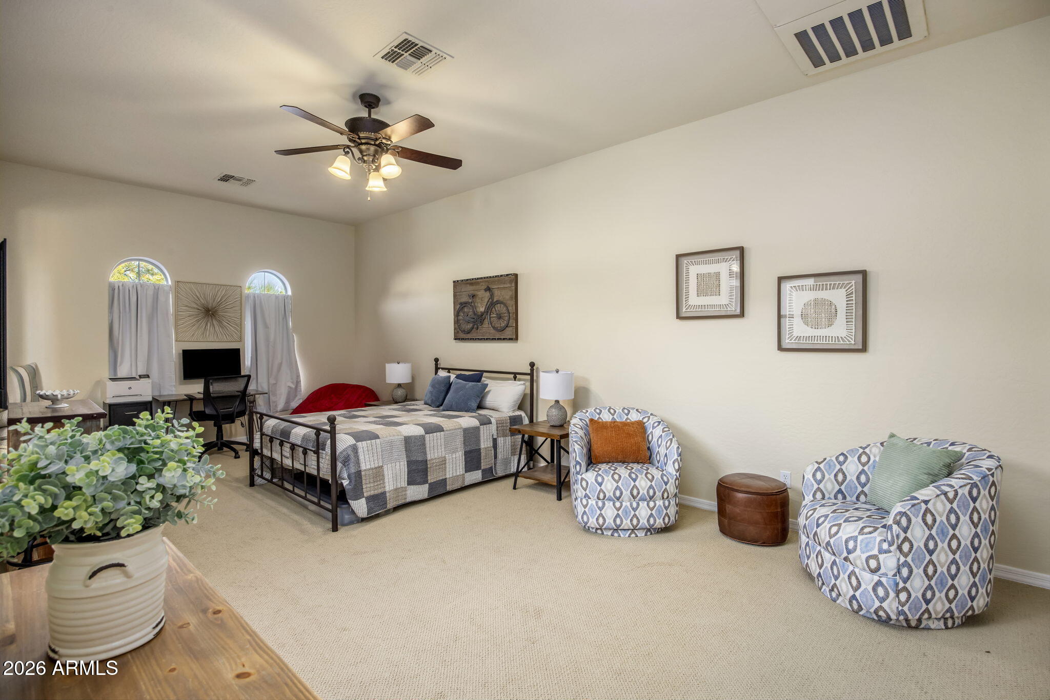 14112 North 12th Street Phoenix, AZ 85022 - Photo 26 of 46 a spacious bedroom with a bed and a chandelier