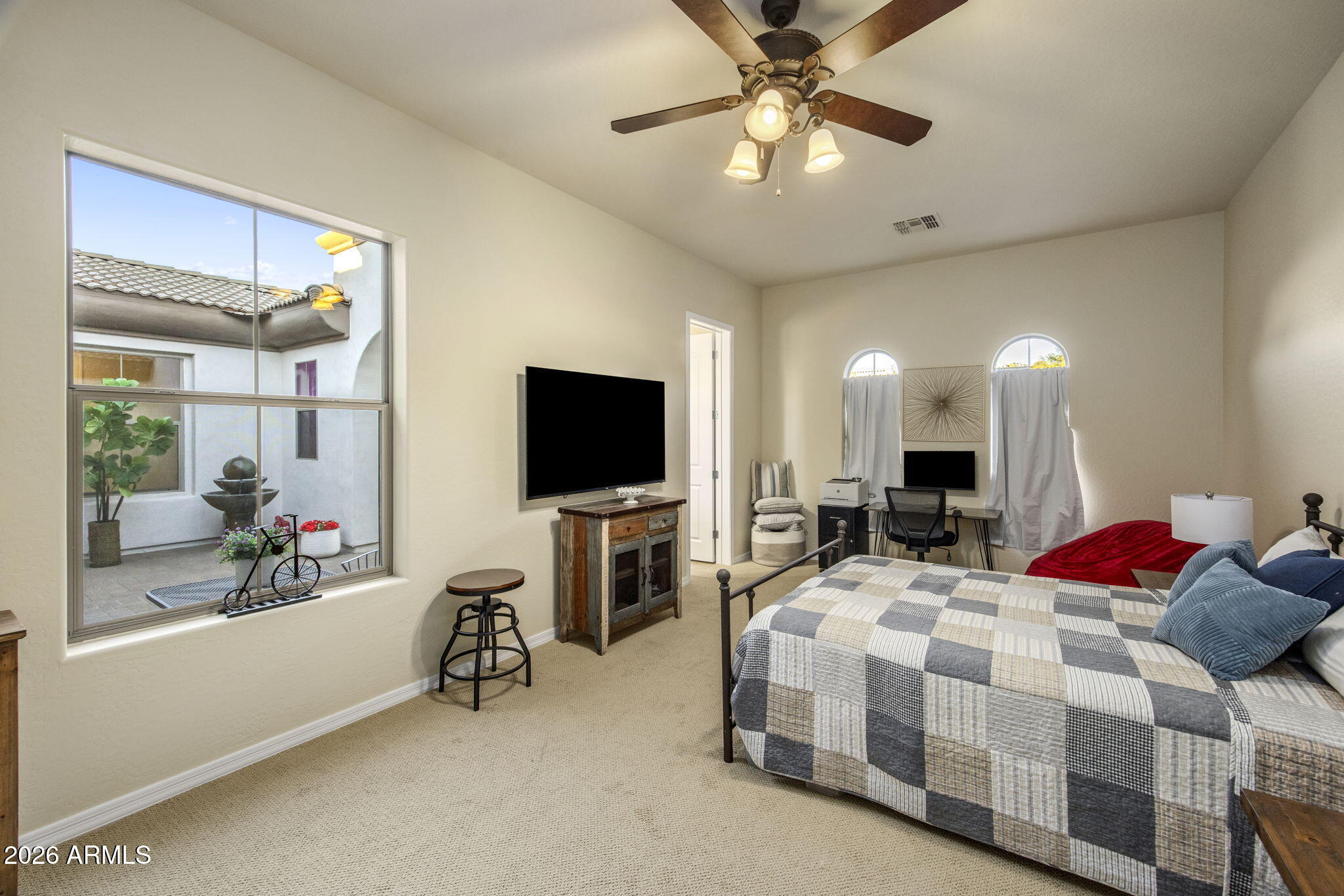 14112 North 12th Street Phoenix, AZ 85022 - Photo 27 of 46 a bedroom with bed tv and view of living room