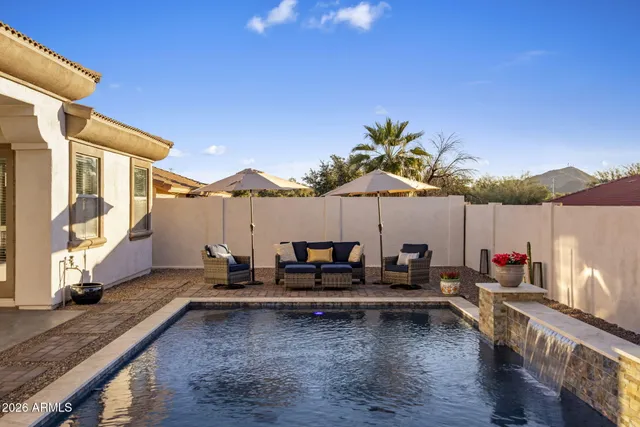 a view of a terrace with couches and sky view