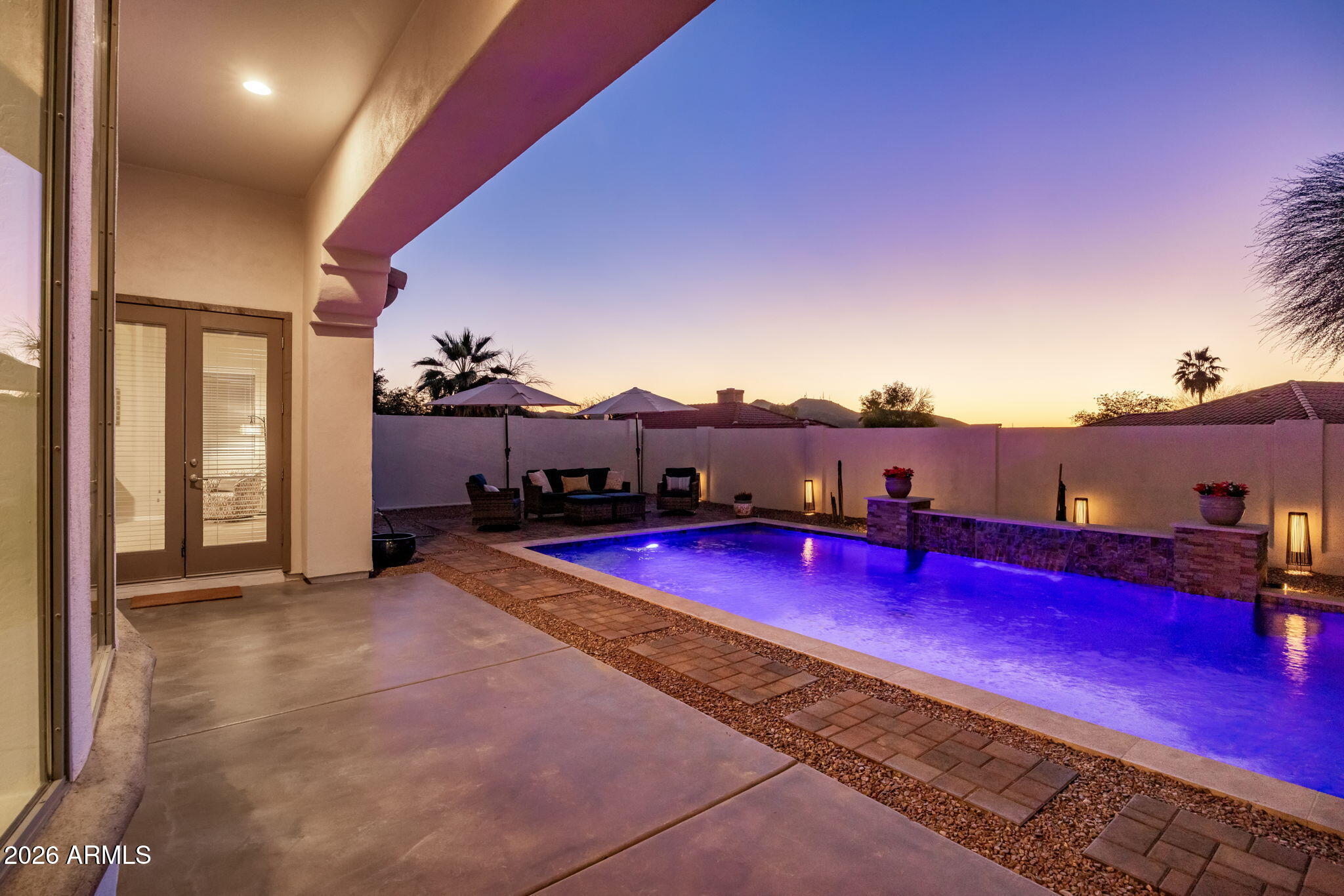 14112 North 12th Street Phoenix, AZ 85022 - Photo 37 of 46 a view of a pool with lawn chairs and wooden fence
