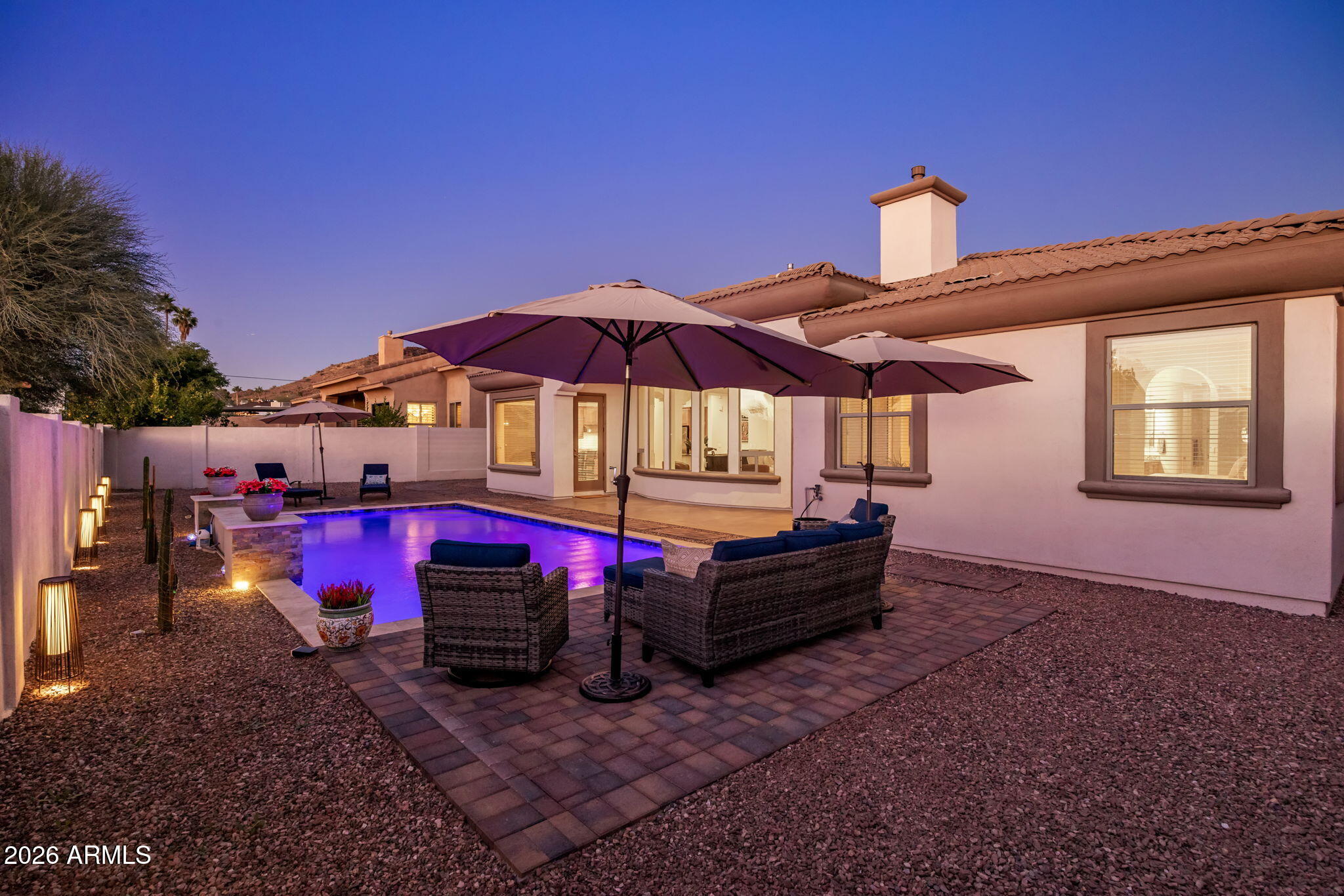 14112 North 12th Street Phoenix, AZ 85022 - Photo 39 of 46 a view of a deck with a table and chairs under an umbrella