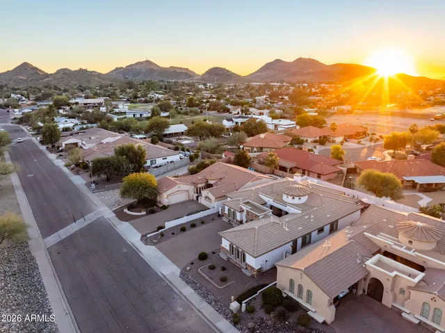 an aerial view of residential houses with outdoor space