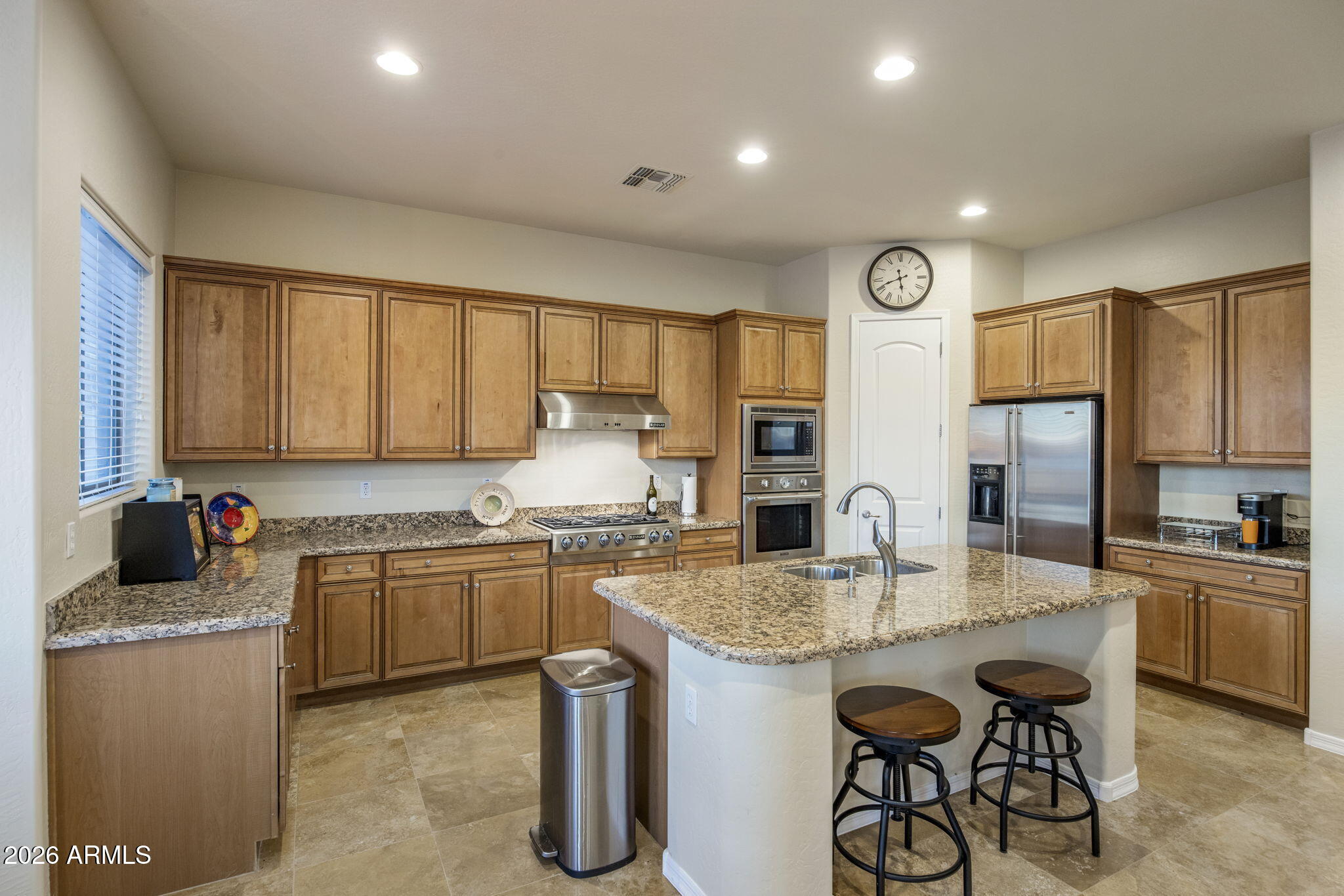 14112 North 12th Street Phoenix, AZ 85022 - Photo 10 of 46 a kitchen with a stove a sink and a refrigerator