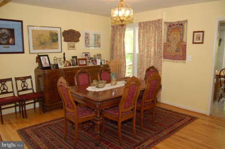 13114 Broadmore Road Silver Spring, MD 20904 - Photo 3 of 22 a view of a dining room with furniture and chandelier