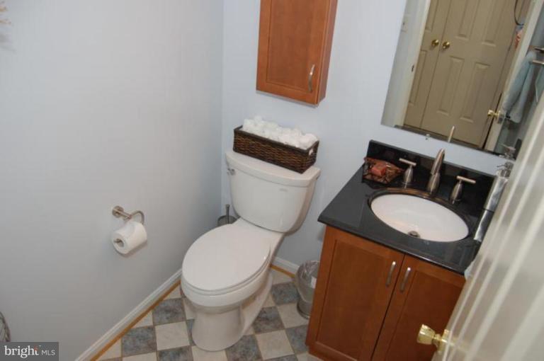 13114 Broadmore Road Silver Spring, MD 20904 - Photo 21 of 22 a bathroom with a toilet sink and mirror